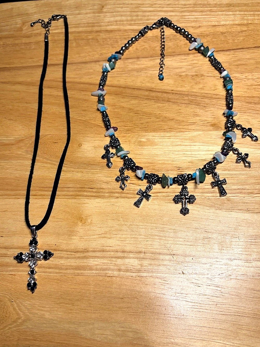Set of 2 Cross Necklaces. One Silver tone with beads and the other silver tone w